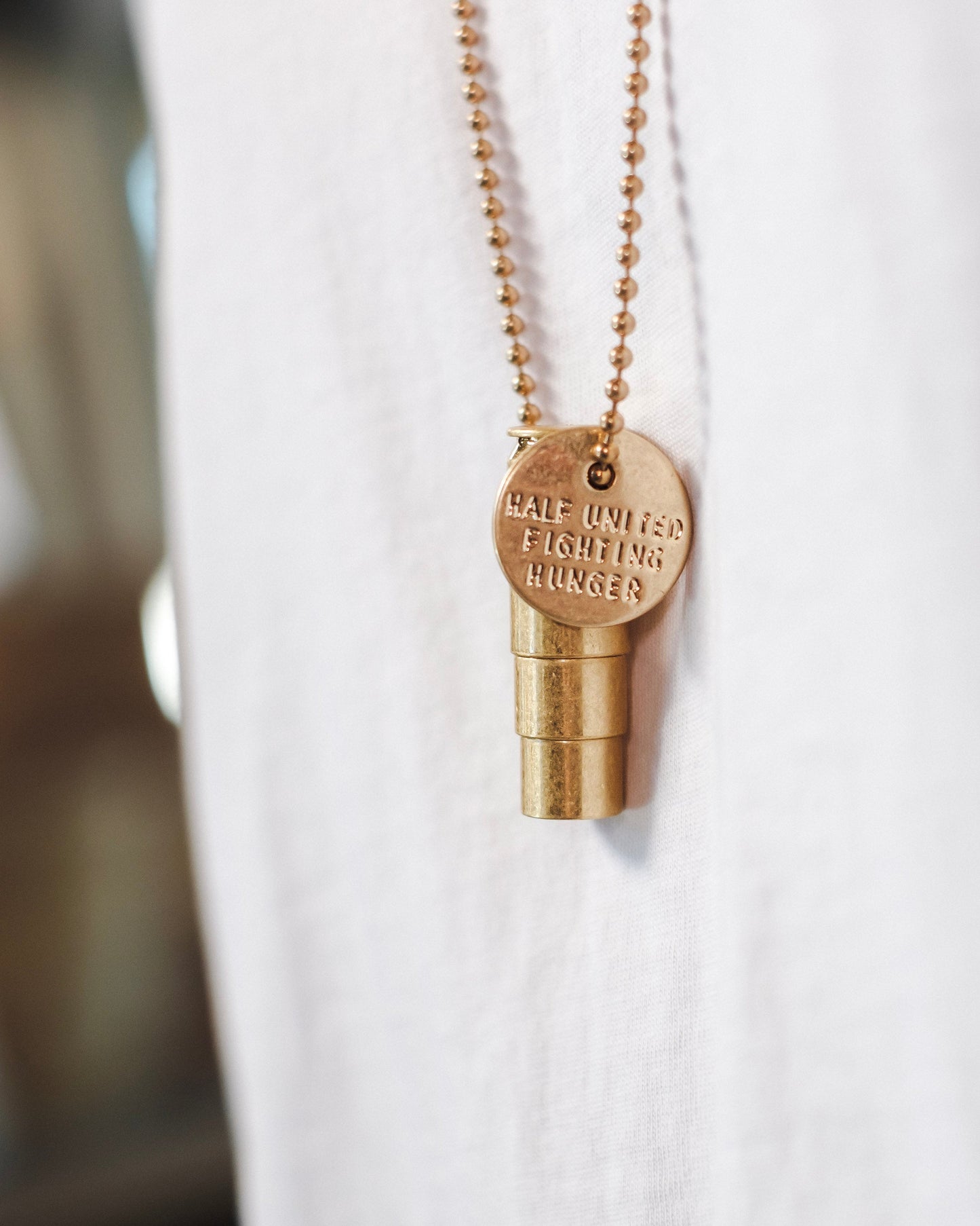 Half United Fighting Hunger Bullet Necklace- Gold